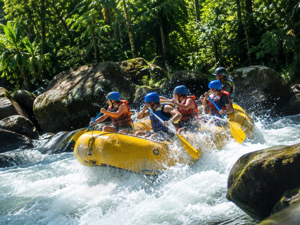 White-water rafting through a rainforest river in Costa Rica